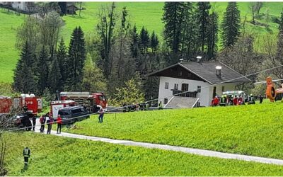 Person unter Raupenfahrzeug